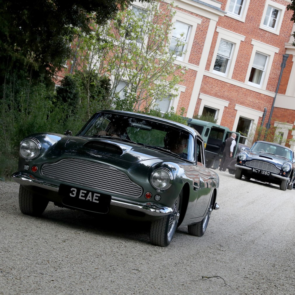 Aston Martin Infront Of House